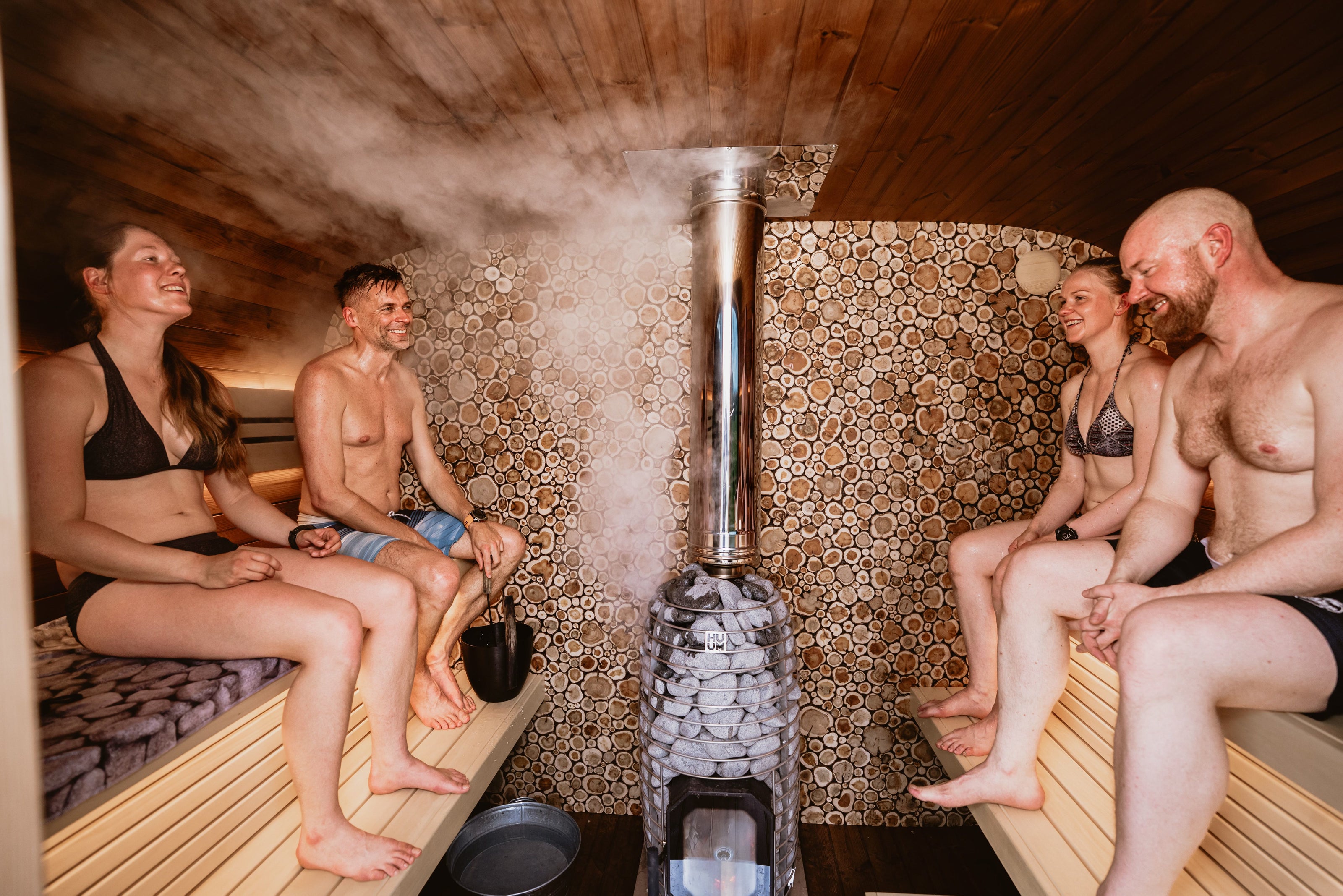 Group enjoying a corporate wellness sauna session